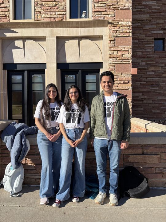 Sukriti with two teammates at HackCU